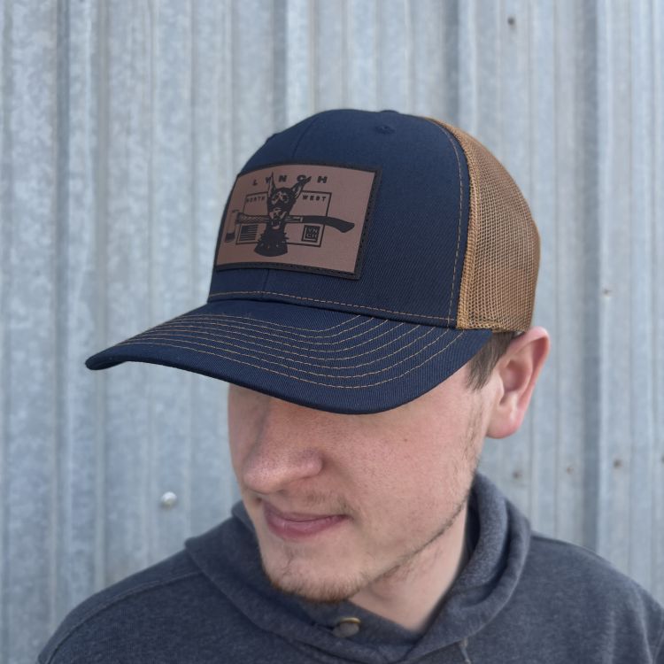 Richardson Navy/Carmel Snapback Trucker Hat with Leather Dog Patch (112)